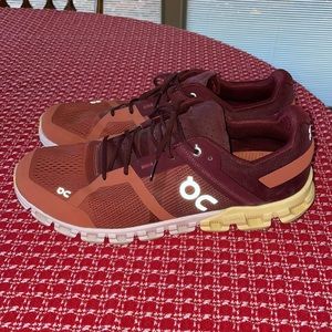 Orange and maroon On Cloud Running sneakers